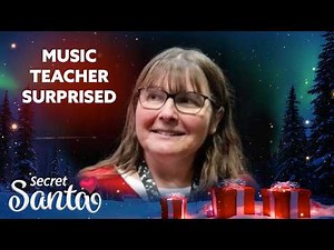 Humble music teacher surprised with gifts from a Secret Santa in front of students