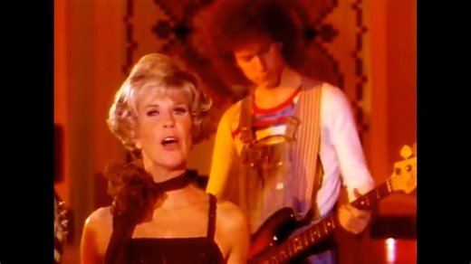 As an icon of optimism and cheerfulness, Doris Day captivated audiences worldwide with her sweet voice and charm. Although her peak singing career was before the rock and roll era, her talent has always been beloved. The song "Day By Day" is not one of her classic pop hits but a meaningful performance from her 1975 television special. The song was written by Stephen Schwartz, a famous Broadway composer and lyricist. "Day by Day" was originally written for the Broadway musical Godspell (1971). Do