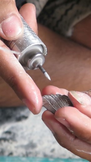 ✨ Behind the Beauty ✨ Take a closer look at the incredible skill of our artisans in Bali as they cut and carve natural shells for our unique jewelry designs. Though not a glamorous process, you can see that each piece is a true labor of love and tradition, made by hand with heart. 💙🌊 #HandcraftedJewelry #BalineseCraftsmanship #BehindTheScenes #ShellJewelry | Robert Manse Designs