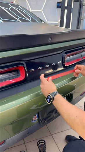 Logo Vibe on Instagram: "Red Letter Authority: Dodge Challenger Emblem 🔴✨ LOGO VIBE energizes the Dodge Challenger emblem with red vinyl lettering for bold muscle identity. High-contrast color reinforces performance heritage with controlled precision. Power deserves visibility. Should muscle always announce itself? 😈 #DodgeChallenger #EmblemWrap #RedAccent #MuscleCar #LogoVibe"