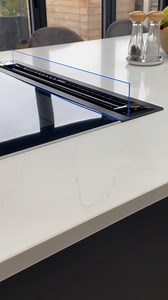 In this kitchen design we installed a Siemens glass downdraft extractor in the kitchen island. This feature keeps the space looking modern, seamless and clutter-free, allowing the room to feel more spacious without an extractor hood overwhelming it. What do you think of this feature? 🤩 #luxurykitchendesign #siemens #kitchendesignideas #modernkitchens | Thomas James Bespoke Kitchens