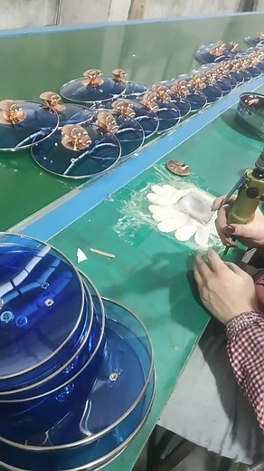 186K views · 347 reactions | Watching this assembly line in action is truly mesmerizing! Skilled workers swiftly screw handles onto pan covers with precision and efficiency. Their speed and accuracy make the process look effortless, showcasing the power of teamwork and expertise in manufacturing! | Asian Technology | Facebook