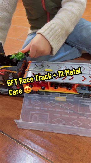 This toy truck playset is such a toddler win! You get a 5-foot race track, 12 die-cast metal cars, lights   sounds, and a carrier truck that doubles as storage. #toddlersoftiktok #christmasgiftideas #momsoftiktok #tiktikshopblackfriday #tiktokshopcybermonday