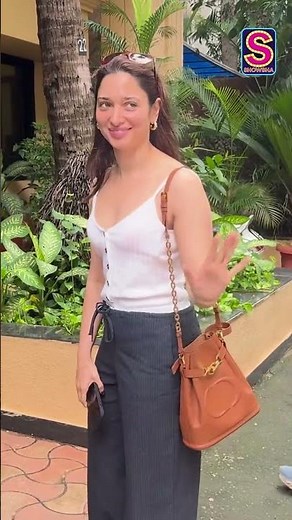 Tamannaah Looks Pretty In White Tank Top & Blue Jeans