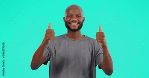 Happy, face and black man with thumbs up in studio isolated on a blue background mockup space. Portrait, like hand gesture and African male person with emoji for success, review or thank you for vote