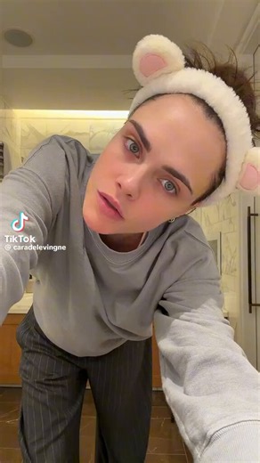 Cara Delevingne posts herself to the ‘hate that I made you love me’ & ‘baby one more time’ remix via TikTok: “These songs together is EVERYTHING!”