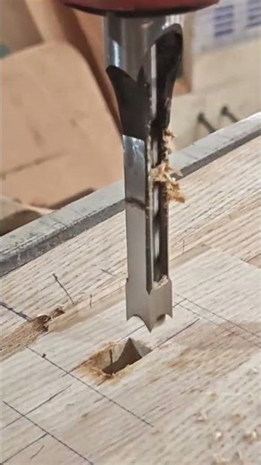 Creating a rectangular hole in a wooden board using a specialized square hole drilling machine tool