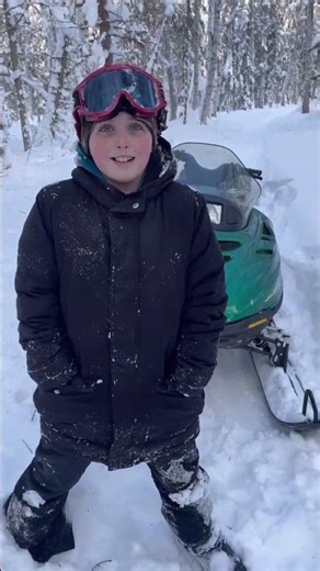 In Alaska deep bush cutting open trails during a hard winter snow fall.