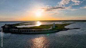 Sunset view of Hurst Point Lighthouse is located at Hurst Point in the English county of Hampshire, UK