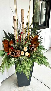 Kicking off a busy holiday season with these elegant planters! This front porch looks so inviting now 🤩 #floraandferncontainergardens #winterporchpots | Flora & Fern Container Gardens