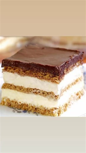 No Bake Ice Box Eclair Cake! 🍰🍰🍰 Recipe: 1box of graham crackers, 2 small boxes of instant cheesecake pudding mix, 3 cups milk, 8 oz tub of whipped topping, 1can sweetened condensed milk, 16 oz of chocolate chips. Optional additions: crumbled Heath bar toffee bits or chopped nuts. Line a 9 x 13 cake pan with graham crackers. Mix pudding and milk till thick and fold in whipped topping. Pour 1/2 of the pudding mixture over the graham crackers and spread evenly ( an offset spatula makes this ver