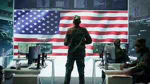Military personnel in a base of operations using advanced computers and big screen, monitoring satellite systems to enhance security measures and process data. High tech army gear. Camera B.
