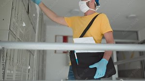 Mailman delivering mail with mail-bag and protective mask and gloves during virus pandemic.