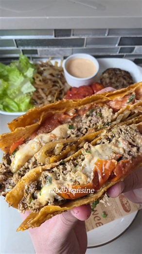 The Spiced Kofta-Burger Tortilla Wrap ​Ingredients ​For the Beef Patty: • ​Ground Beef: 2 lb (approx 1kg) • ​Aromatics: Finely chopped onion and fresh parsley • ​Binder/Moisture: 1/3 cup plain Greek yogurt & 1/4 cup tomato sauce • ​Spices: 1 tbsp salt, 1 tsp black pepper, 1 ½ tbsp kofta spices, 1 ½ tbsp paprika, 1 tbsp turmeric • ​The Core: 1 thick slice of your favorite cheese (Cheddar or Swiss) plus a handful of shredded mozzarella ​For the Wrap & Toppings: • ​Tortillas: Large flour tortillas 