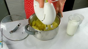 Chef woman using electric mixer preparing mashed potato in saucepan on kitchen. Culinary skills techniques, homemade preparing healthy meal, cook domestic food dish, cuisine, vegetable puree.