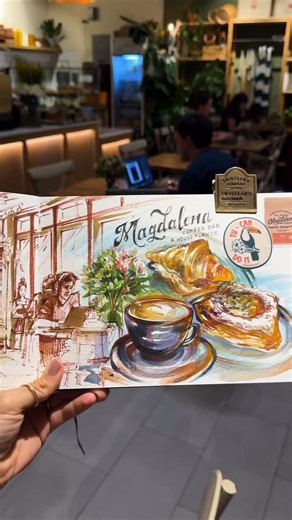 ᴊᴇss ᴋᴀʀᴘ on Instagram: "When you don’t realize that’s the owner 🥹🪴 This was a beautiful day, sketching at a café and capturing the scene and essence. Little that I know that the owner had approached me and wanted to see the artwork (I found that out a little later haha) This was such a sweet and welcoming space to decompress and draw for the day. Thanks for having it @magdalena.coffee Watch the full sketchbook date experience on my YouTube channel for the full story. 💕 — #sketchbook #artists