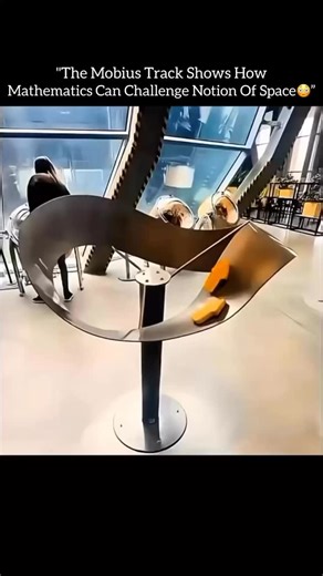 @nextgen_bytess on Instagram: "The Möbius track shows how mathematics can challenge our notion of space♾️🧠 At first glance, it looks like a simple looped track, but the Mobius track has only one continuous surface and one edge. This strange structure breaks our everyday understanding of inside and outside. When an object moves along it, it returns to the starting point flipped, without ever crossing an edge. Engineers, artists, and scientists study this concept to explore symmetry, infinity, an
