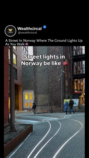 Wealth Circal™ | At first it doesn’t even look real. The pavement is glowing — shifting between purple, blue, and pink like liquid light moving under the... | Instagram