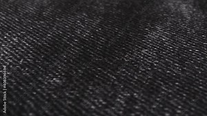 Black denim, jean fabric cloth background. Fashion, modern dress material. Stock Video