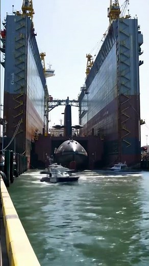 A close-up look at a submarine dry dock operation. #navy