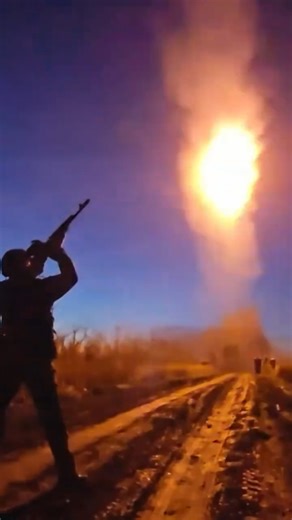 A Grad rocket launcher fires at Ukrainian terrorists at night