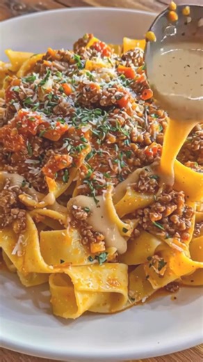 Pappardelle Ragu Ready in about 45 minutes, this hearty dish is one of those classic pasta recipes that taste like pure Italian food comfort. Wide ribbons of pappardelle soak up a rich, slow-simmered beef and tomato ragu—perfect for a cozy easy dinner or a Sunday family meal. Every bite feels like a warm hug from Italy. Ingredients: 12 oz pappardelle pasta 1 lb ground beef (or a mix of beef and pork) 2 tbsp olive oil 1 small onion, finely chopped 2 cloves garlic, minced 1 carrot, finely diced 1 
