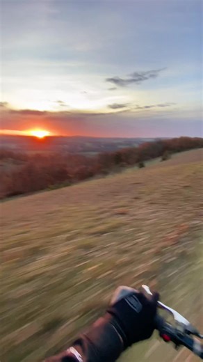 Dirt Bike Ride Through Autumn Forest at Sunset