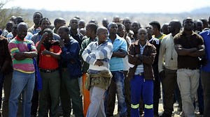 South African miners back to work