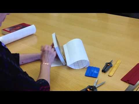 Applying self-adhesive laminate