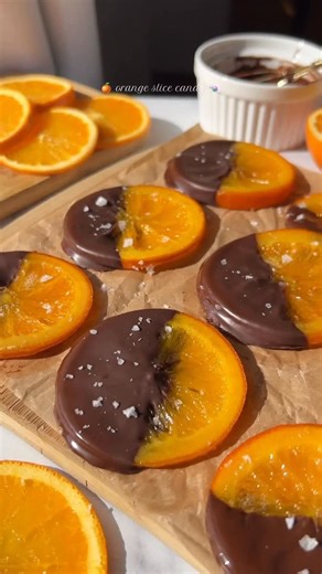 Desserts on Instagram: "🍊 Orange sliced candy ✨ Ingredients * 1½ cups sugar * 1½ cups water * 3 oranges * 1 bar dark chocolate (preferably orange-flavored) * Flaky salt, for garnish Directions 1. Bring 2 cups of water to a boil in a saucepan. 2. Wash and thinly slice the oranges, discarding the ends. 3. Blanch the slices in the boiling water for 2 minutes to remove bitterness. 4. Remove the slices and place them on a wire rack to drain. Discard the water. 5. In the same pan, combine 1½ cups wat
