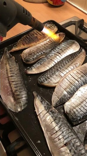 Cooking mackerel using a blow torch
