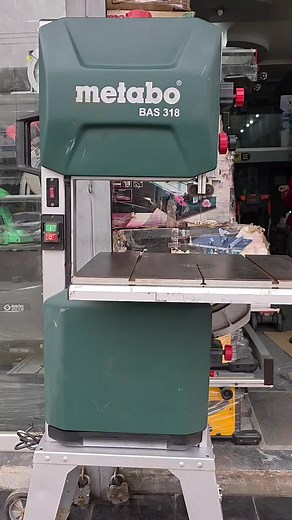The Metabo BAS 318 Band Saw! Key Features 1. _Powerful 1050W Motor_: Delivers high-performance cutting. 2. _Variable Speed Control_: Allows for optimal speed adjustment (100-420 m/min). 3. _Robust and Durable Design_: Long-lasting and resistant to wear and tear. 4. _Ergonomic Handle_: Reduces fatigue and provides comfortable grip. 5. _Adjustable Cutting Angle_: Enables precise and flexible cutting. Technical Specifications 1. _Motor Power_: 1050W 2. _Speed_: 100-420 m/min 3. _Cutting Capacity_: 