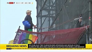 An #ExtinctionRebllion activist, named by the protest group as tree surgeon Ben Atkinson, has 'free-climbed' the base of Big Ben. He is reportedly wearing a costume and a blonde wig mimicking the PM Boris Johnson. Follow the latest on this story: http://po.st/aUKs5b | Sky News