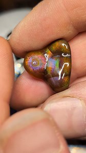12K views · 617 reactions | A rare locale for fire agate, this beautiful gem was cut by Eric Bulger. That dragon scale crackle under they padparadscha pink/orange translucent eye.....so good :) #differentseasonsjewelry #gemstone #agate #artist #geology #art #earthscience #crystal #fireagate | Mark S. Anderson | Facebook