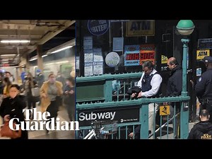 Brooklyn subway shooting: video shows people running through smoke in New York City