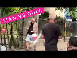 Hilarious Commentary of a Cheeky Seagull Launching a Surprise Attack to Steal Sausage From Man's Sandwich
