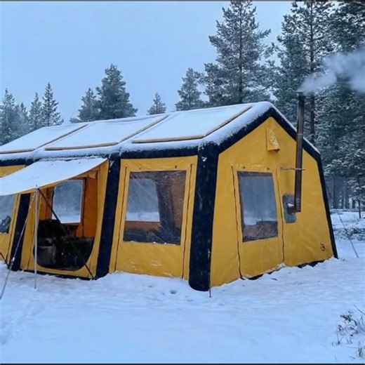 This isn't just camping, this is glamping! ❄️🏠 In this video, I take winter camping to the next level with a massive yellow inflatable tent that feels more like a cabin in the woods. It is spacious enough for comfortable beds and chairs, and the wood stove keeps the whole place incredibly warm while the snow falls outside. Relaxing with a hot drink and looking out the big windows is a dream come true. Do you prefer luxury camping like this or a small primitive shelter? Tell us below! 👇 Follow 