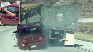 Video shows truck dragging car – with driver still inside – after collision