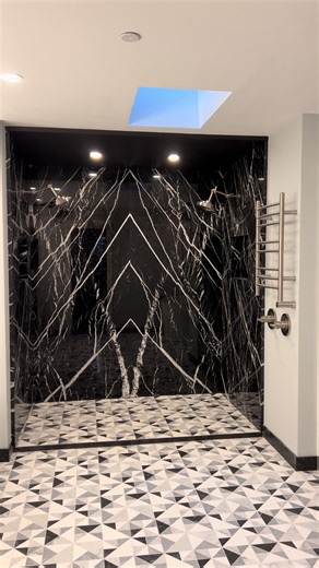 Marble slabs wrapping the walls and ceiling, paired with a black-and-white mosaic tile floor for a balanced, luxury look. #marbl #marblewalls #showerwalls #luxurybathroom #bathroomremodel #renovation#granitemarblespecialties #blackmarble #beautiful #customwork #stonework #seattlecountertops #fyp #fypシ #fypシ゚viral #viral #viralvideo #viraltiktok