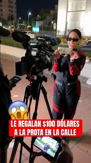 The protagonist is given $100 and is overjoyed in the streets of Planet Alofoke 😂 #shorts