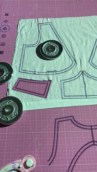 Genuinely Em | Pattern Designer, Grading Services & Courses on Instagram: "Projector sewing is taking over! Are you tempted to try it out? For me, the scariest part was figuring out how to calibrate it. You want all the lines to match with your cutting mat and make sure your projection is at 100% scale. That way the pattern you are cutting is true to size and not distorted. I was spending about 30 minutes each time I used my projector to calibrate it until I found @patternprojector. This is not