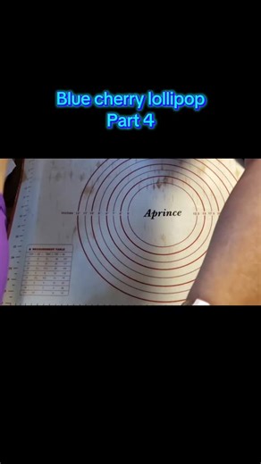 Andrea S on Instagram: "Blue cherry candy part 4 🍒💙 Time to make the giant lollipop! The blue swirls formed out so beautifully—this one’s a showstopper. #candymaking #handmadecandy #lollipopart"