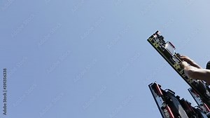A man assembles LED panel elements, assembling a large LED screen. Free space for text on the side. LED screen panel