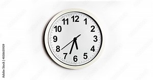 Round clock hangs on a white wall. The clock shows around 4 o'clock or 16 o'clock, the minute and second hands approach 6. plastic dial. time. Time lapse 4k of a wall clock. Time is running out fast
