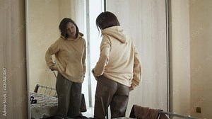 Woman changing clothes in the bedroom