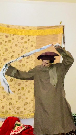 Traditional Scarf Performance in Cultural Attire