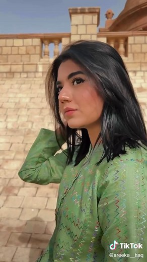 Traditional Outfit Showcase in Historical Architecture