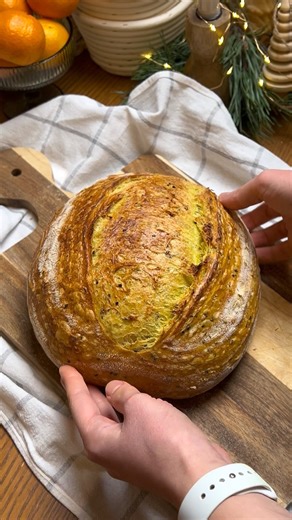 Alina on Instagram: "SOURDOUGH BREAD for Christmas Eve 🎄 Quick & Super Easy RECIPE 🤫⤵️ Dough: 340 g bread flour 60 g whole wheat flour 280 g water 200 g active sourdough starter (100% hydration) 10 g salt Add-ins: 1 g turmeric powder (about ½ tsp) 10 g black sesame seeds If you’d like to see the full process with all the details, just leave a comment and I’ll upload it very soon 🥰 #christmasrecipes #sourdoughbread"