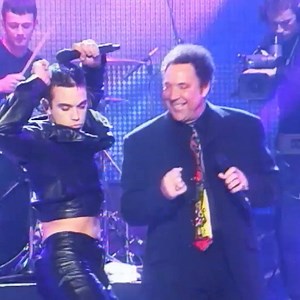596K views · 1.7K reactions | Robbie Williams wearing double leather while on stage with Sir Tom Jones, a BRITs performance we will never forget! | BRIT Awards | Facebook