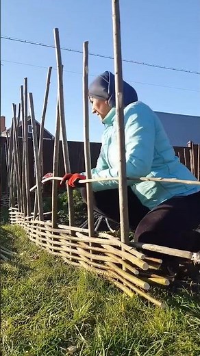 The process of making a fence with tree branches